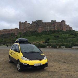 Bumble camper beside a castle