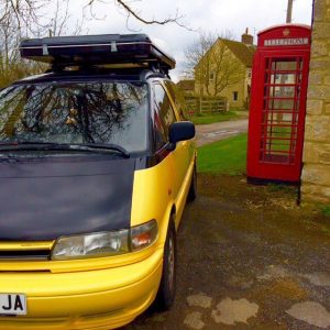 Bumble camper beside a red telephone box